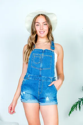 Denim Mini Short Overalls with Layered Front Bib Pocket, Distressed Detail, and Frayed Cuffed Hem in Medium Blue (3121RS)